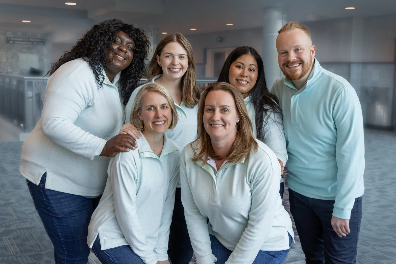CYAN of Pennsylvania's staff smile together in matching sweaters.
